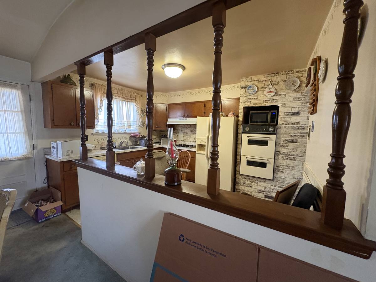 Before: Williamstown NJ estate — debris-filled interior